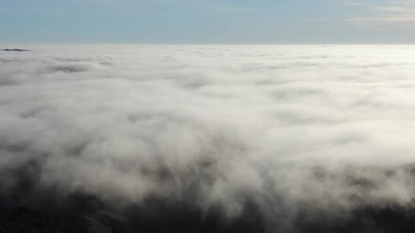Aerial View Flying Above the Clouds
