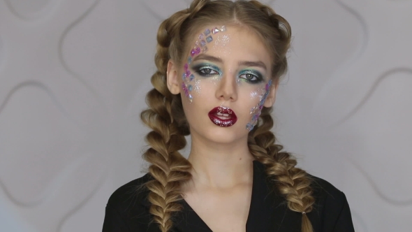 Fashion Makeup Woman with Colorful Makeup and Body Art