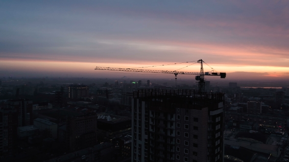 Aerial Drone Shot of Construction Site of Modern Glass Office Building in City alt
