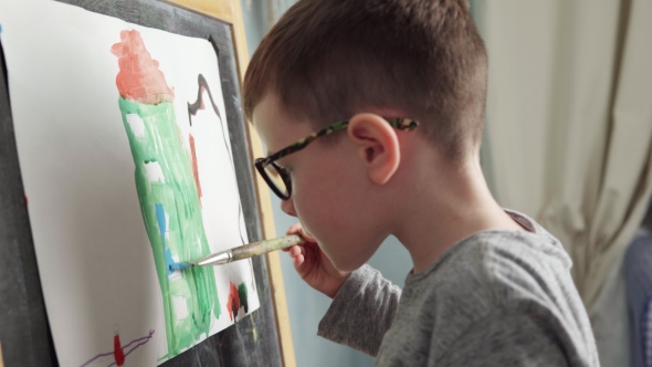 Cute Little Boy Paints House with Watercolor