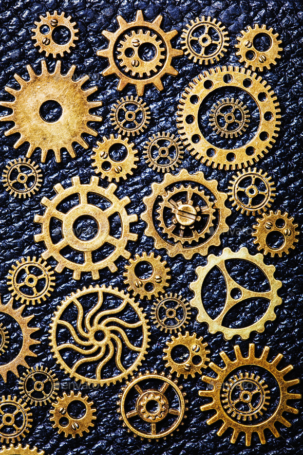 steampunk mechanical cogs gears wheels on leather background