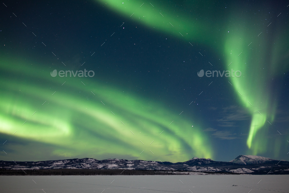 Aurora borealis Northern Lights snowy winter scene - Stock Photo - Images