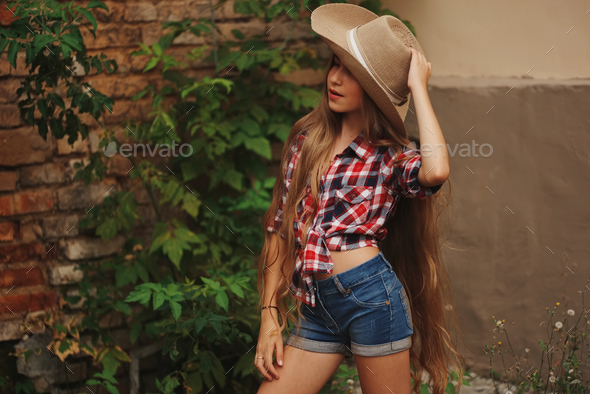 beautiful young cowgirl with long hair Stock Photo by ababaka | PhotoDune