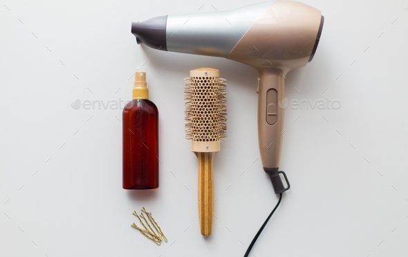 hairdryer, brush, hot styling hair spray and pins