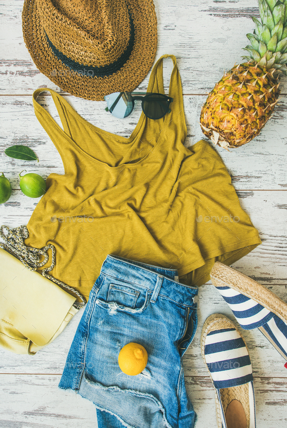 Colorful summer fashion outfit flat-lay over pastel parquet background - Stock Photo - Images