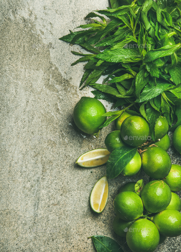 Flatlay of fresh limes and mint for making cocktail, lemonade - Stock Photo - Images