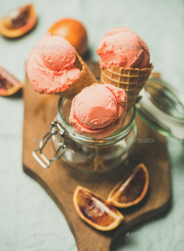Refreshing summer blood orange ice cream on wooden board - Stock Photo - Images