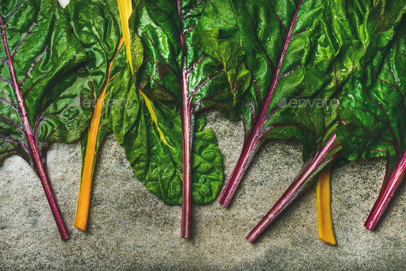 Flat-lay of fresh green leaves of swiss chard, top view - Stock Photo - Images