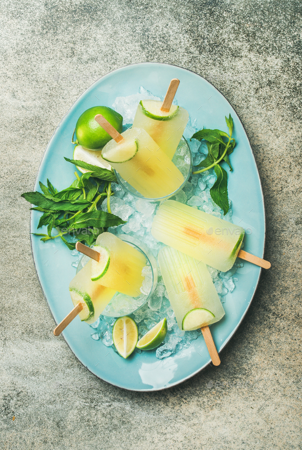 Summer refreshing lemonade popsicles with lime and mint on plate - Stock Photo - Images