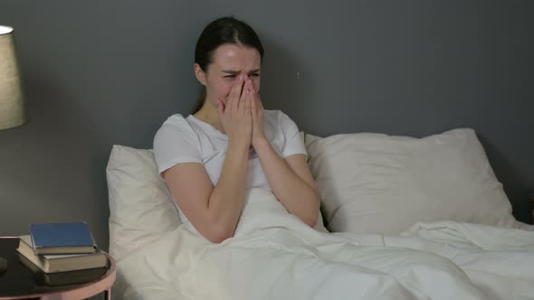 Upset Young Woman Crying in Bed  alt