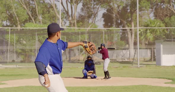 Baseball player throwing a ball during a match alt
