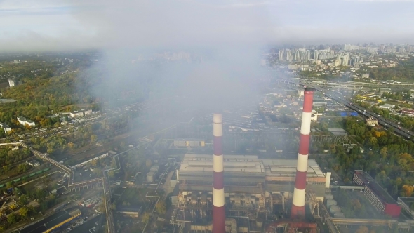 Flying Over the Pipes of the Plant From Which the Smoke Goes alt