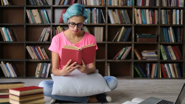 Overworked Female Student Napping While Studying alt