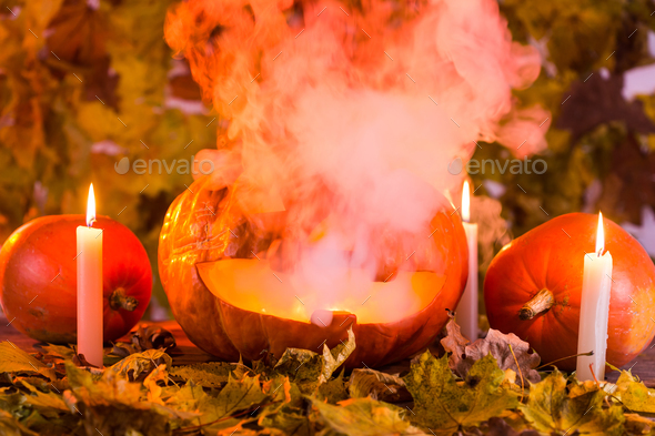 Jack-o-Lantern halloween pumpkin with mist pouring from it's mouth