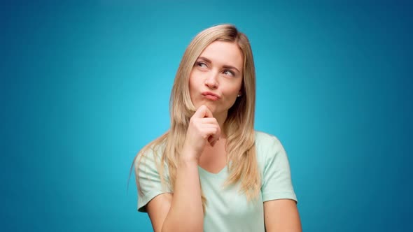 Blonde Woman Thinking Over Smart Idea Pondering Against Blue Background alt