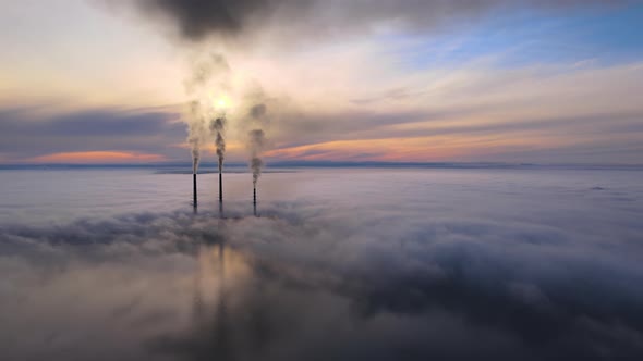 Coal Power Plant High Pipes with Black Smoke Moving Upwards Polluting Atmosphere alt