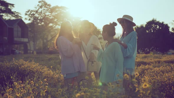 sun flare light ray with group of asian female friend laugh smile joyful travel together