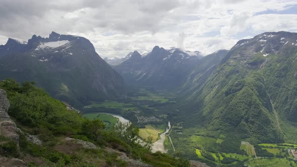 Rauma River At The Green Valley Of Romsdalen In Aandalsnes Town, More Og Romsdal County, Norway. sta alt