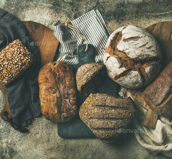 Flat-lay of various bread loaves, top view - Stock Photo - Images