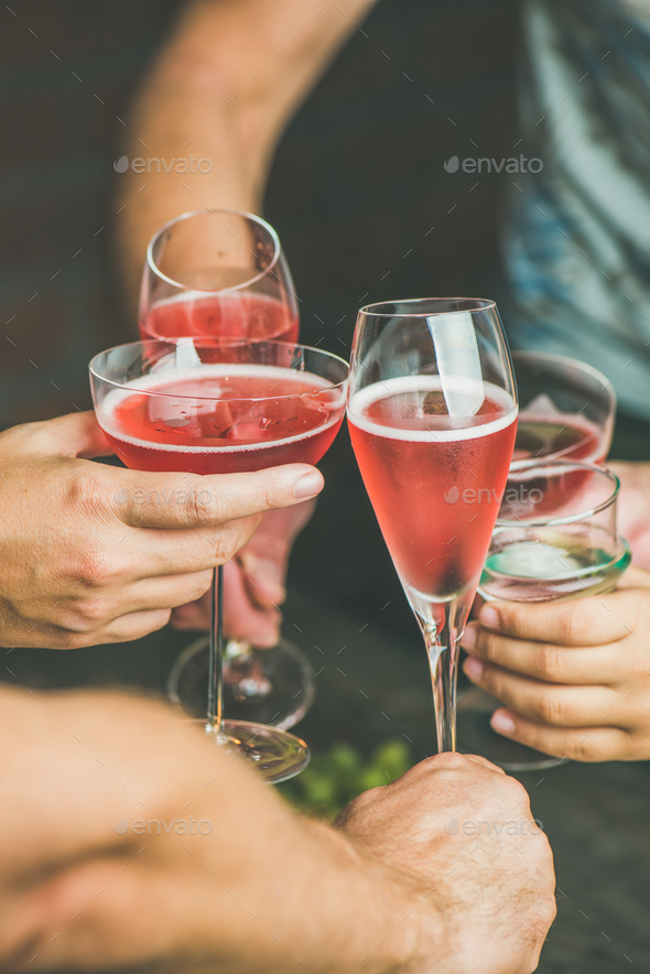People having party, gathering, celebrating with rose champaign, vertical composition - Stock Photo - Images