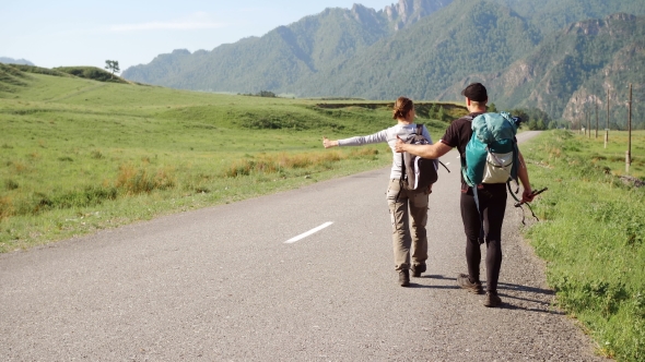 Travel Hitchhiker Couple on a Road alt