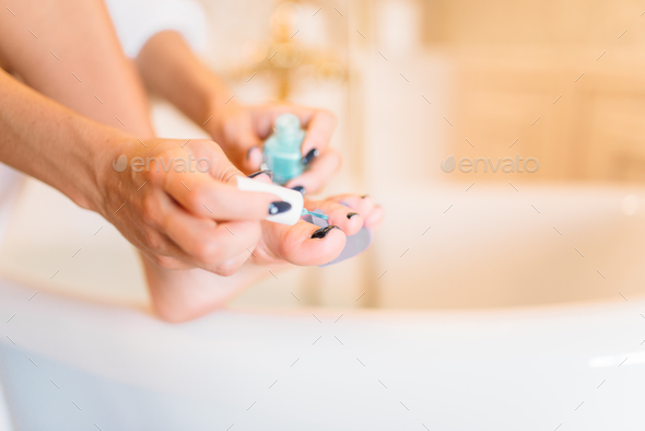 Female person hands with nail polish, pedicure Stock Photo by NomadSoul1