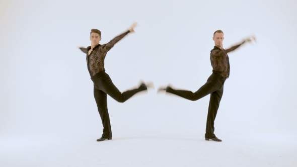 Two Men in Black Suits Dancing on a White Background.