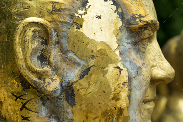 Closeup of unfinished bronze head.