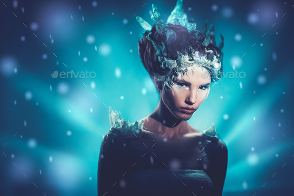 Beautiful ice queen in a falling snow - Stock Photo - Images