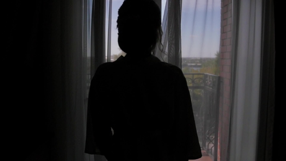 a Young Woman Approaches the Window, Opens To a Balcony, Enjoying ...