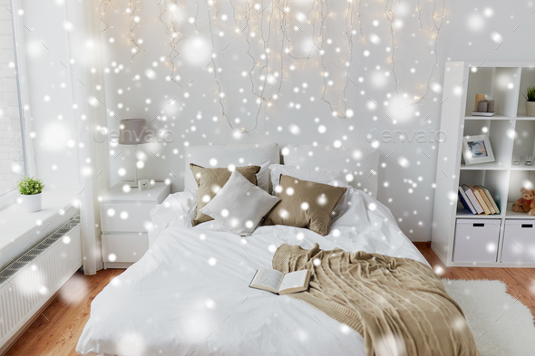 bedroom with bed and christmas garland at home