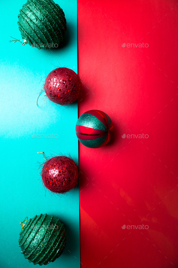 Christmas ball on green and red pepper backround. - Stock Photo - Images