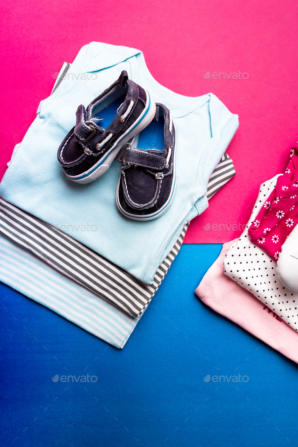 Folded blue and pink bodysuit - Stock Photo - Images