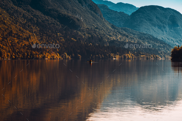 Man rowing boat on Lake Bohinj - Stock Photo - Images