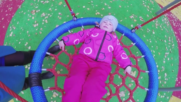 Girl Child on Rotating Swing