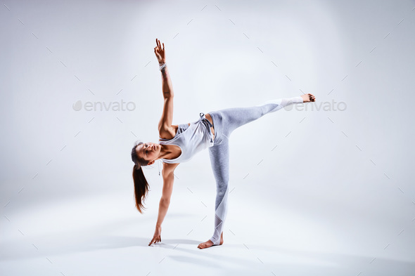 Woman doing yoga isolated on white background - Stock Photo - Images