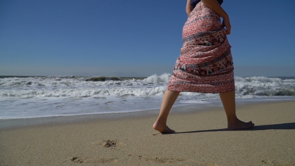 Girl Walking on the Beach