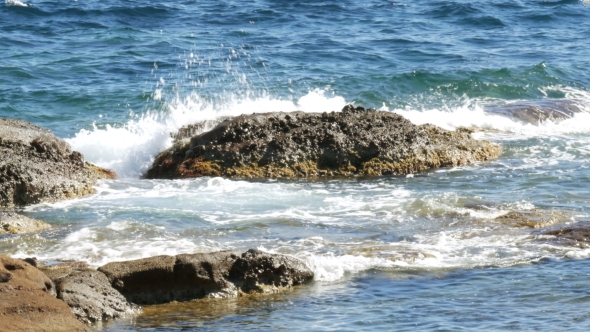 Peaceful Waves Splashing on Stony Beach