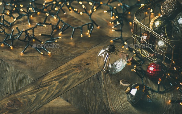 Christmas tree decoration glass balls in box and light garland - Stock Photo - Images