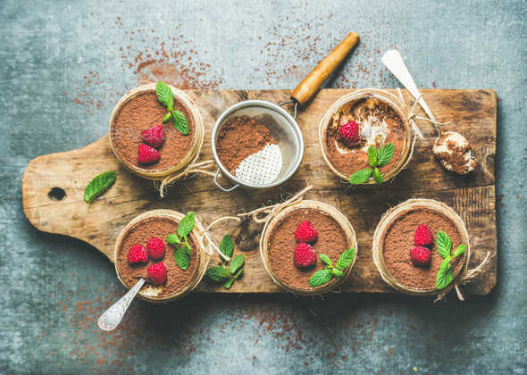 Homemade dessert Tiramisu in glasses on wooden board - Stock Photo - Images