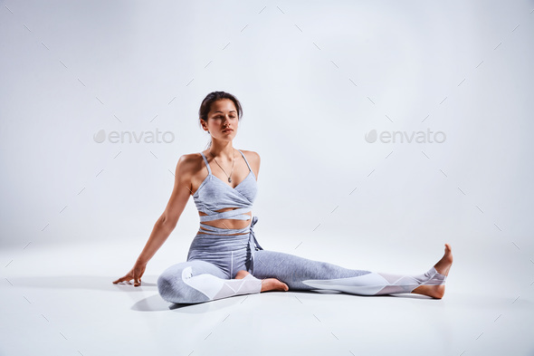 Woman doing yoga isolated on white background - Stock Photo - Images