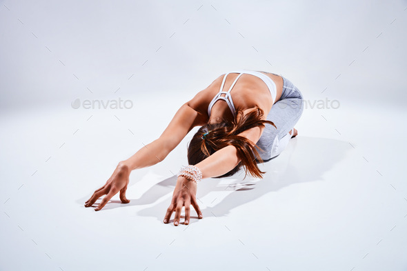 Woman doing yoga isolated on white background - Stock Photo - Images