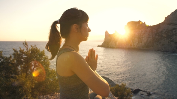 Meditation of Young Woman at Sunset