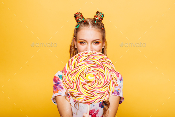 Woman with huge candy instead of a head - Stock Photo - Images