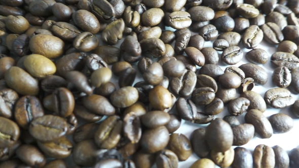 Roasted Coffee Beans Poured in a Heap alt
