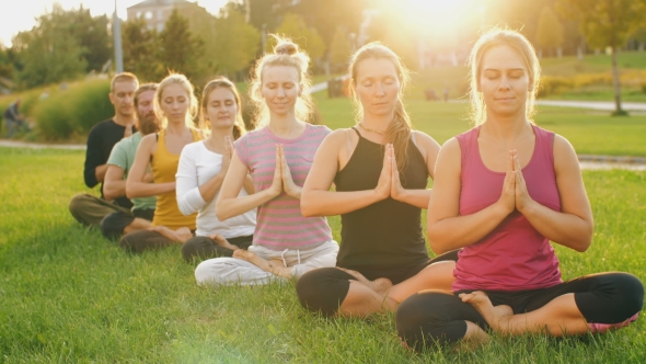 Group of People Meditating at Sunset, Stock Footage | VideoHive