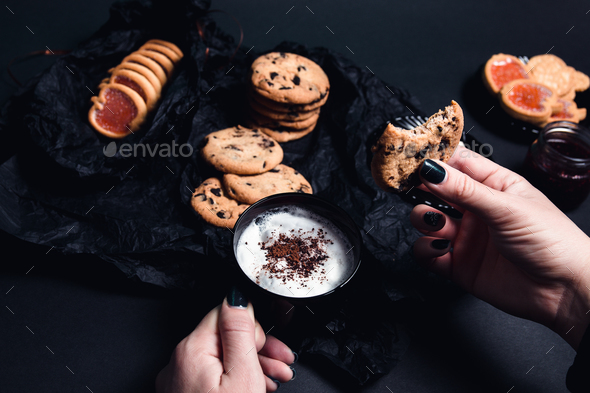 Woman hand with cup of coffee - Stock Photo - Images