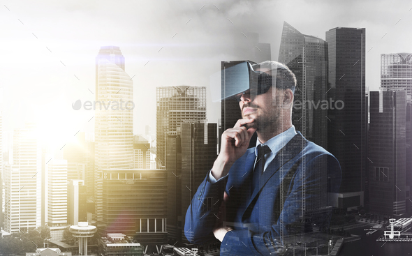 businessman in virtual reality headset over city