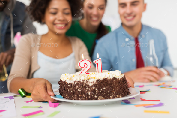 team greeting coworker at office birthday party