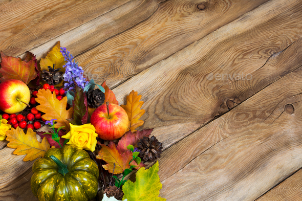 Fall decoration with leaves, pumpkin, apples, lilac flowers and